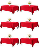 Niuara red fabric rectangle table cloth draped over a 5ft table, six-pack included, ready for gatherings.
