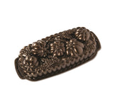 Nordic Ware 93448 wheat-pumpkin cast loaf pan offers a durable, even-baking surface.