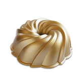 Nordic Ware Swirl Bundt Pan in gold, top view, ideal for elegant desserts.
