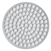 Normcore 58.5mm puck screen close-up showing precise 0.18mm perforations for even extraction