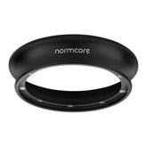 Normcore 58mm magnetic dosing funnel snapped onto a basket for precise espresso dosing.