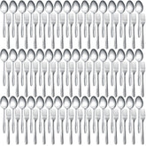 Nuogo 100-piece flatware set on a dining table with mirror finish for elegance.