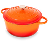 Nuovva enamelled Dutch oven with lid on stove for even heat distribution.