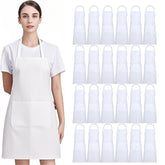 Nymmoata white aprons with pockets front view showing organized utensils.