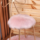 OKAYDA round pink faux sheepskin chair cover shows plush texture for comfort