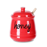 ONTUBE honey jar with dipper and lid for tidy storage.