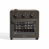 Our Place Wonder Oven front view highlights a sleek stainless steel finish for a modern kitchen.