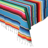 OurWarm blue serape tablecloth with fringe, ideal for outdoor fiestas.