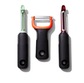 OXO Good Grips 3-Piece Peeler Set peeling beets with non-slip grip.