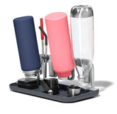 OXO Good Grips aluminum frame bottle drying rack holding four bottles and lids for organized drying