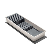 OXO Good Grips compact knife drawer organizer in a drawer for safe storage.