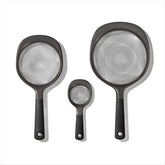 OXO Good Grips mini strainer shown for citrus juice and seeds, compact and precise.