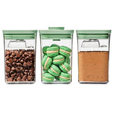 OXO Good Grips Pistachio POP set lids shown on colorful storage containers.