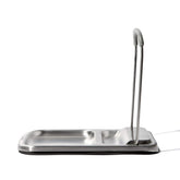 OXO Good Grips spoon rest with lid holder sits on the counter, simplifying cleanup.