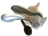 Pampered Chef garlic press 2575 with hopper open for quick garlic and ginger prep.