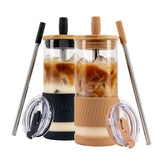Pandaloo glass cups with lids and straws, amber-sand finish, ideal for iced drinks.