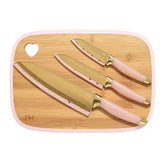 Paris Hilton bamboo cutting board with heart cutout for hanging storage.