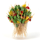 PartyHippo Bamboo Cocktail Picks with tropical design enhance presentation for appetizers.