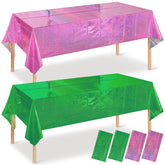 Pascliyna pink and green iridescent tablecloth covers a rectangle table for party setup.
