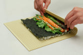 Pat & Doris professional sushi mat with nonstick surface for smooth rolling.