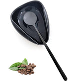 PFCTRJR ceramic spoon rest on a tidy counter beside the coffee maker.
