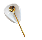 PFCTRJR coffee spoon rest in white and gold keeps countertops tidy after stirring.