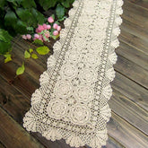 Phantomon lace table runner in beige crochet adds vintage charm to dining tables.