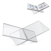PIDINUK clear acrylic book stand assembled on a coffee table with large cookbooks