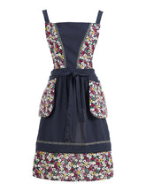 Pinknoke navy floral apron with pockets for easy recipe card storage during cooking
