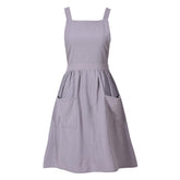 Pinknoke cotton linen pinafore apron gray, front view with pockets for easy recipe prep.