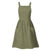 Pinknoke olive green cotton linen pinafore apron front view with pockets for convenient cooking