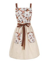 Pinknoke Vintage Pinafore Apron with Pockets in floral beige for comfortable kitchen prep