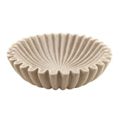 Plukers large beige ruffle bowl on a coffee table showcasing modern decor