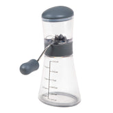 Progressive Nut Chopper base with measurement marks catching chopped nuts.