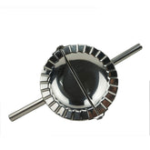 Proshopping XL dumpling maker close-up highlighting the polished stainless steel for clean crimping.