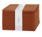 PurpleEssences rust napkins 12-pack laid flat for a cozy farmhouse dining setting.