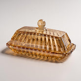 QIANCHANG champagne color glass butter dish on countertop keeps butter fresh and ready to spread.