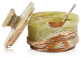 Radicaln marble salt cellar with lid displayed on a kitchen counter for organized seasoning.