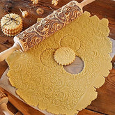 RDGDFONG embossed wooden rolling pin with patterned imprint for even dough designs.