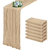 RealBox beige cheesecloth table runner draped on a rustic table for romantic decor