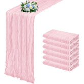 RealBox light pink cheesecloth table runner adds soft elegance to wedding decor.