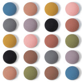 Rhinocats fridge magnets: colorful matte hemispheres for a playful kitchen display.