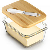 Road to purification glass butter dish with bamboo lid on a kitchen counter for easy butter access.