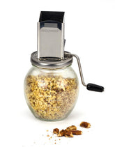 RSVP Endurance nut grinder with glass bottom showing grinding action and texture