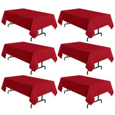 Sancua red tablecloth 60x102 inches on a dining table, offering stain-resistant protection.