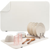 S&T INC. dish drying mat 18x30 cream on counter absorbs water for a dry workspace.