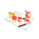 Seelenruhe tempered glass cutting board on a counter with a clear surface for precise slicing.