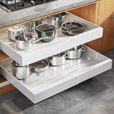 Seinloes expandable pull-out cabinet organizer in a deep cabinet keeps pots within easy reach.