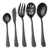 Sharecook matte black serving set with slotted spoon on table, ideal for sauces and salads.