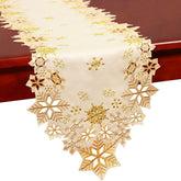 Simhomsen embroidered gold snowflakes runner on holiday table for festive elegance.